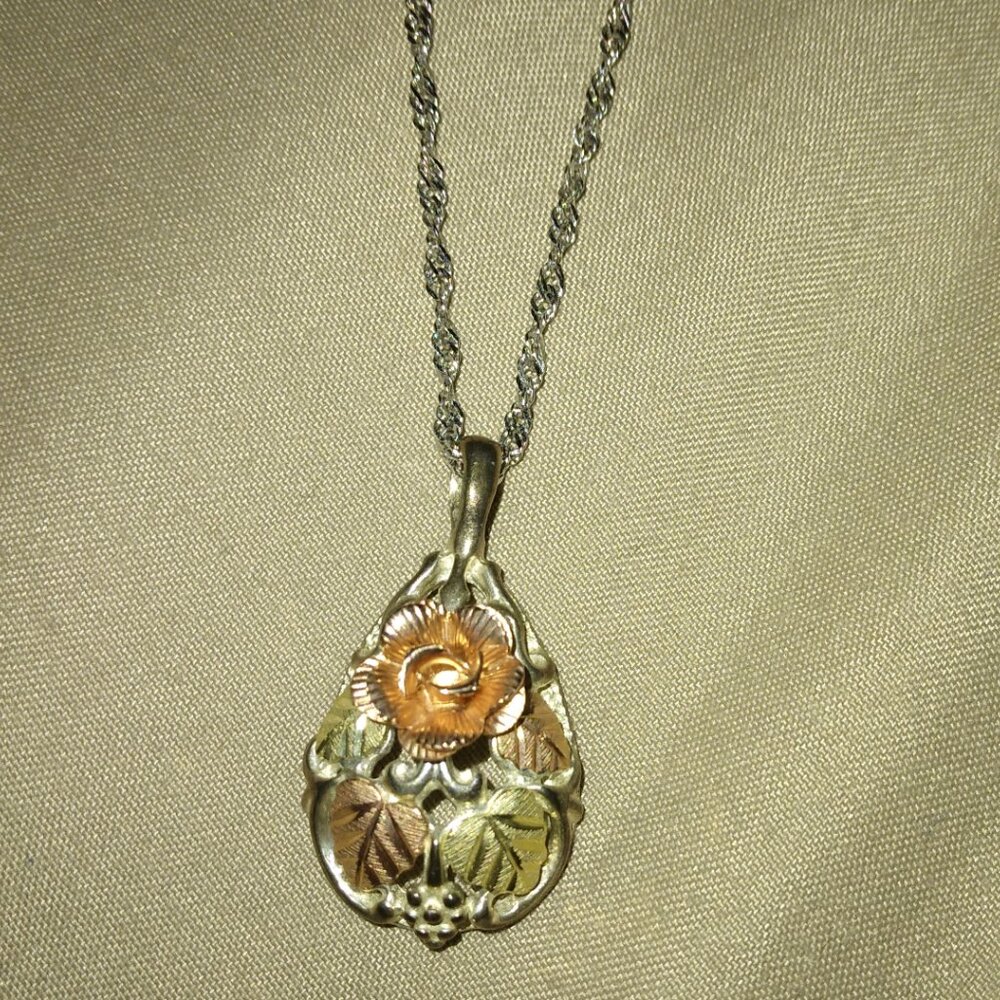 Rose with leaf pendant necklace.